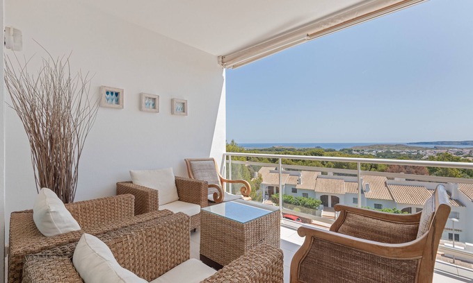 Coves Noves Apartment | Apartment 'Infinity View Menorca' with Sea View, Shared Pool and Private Terrace