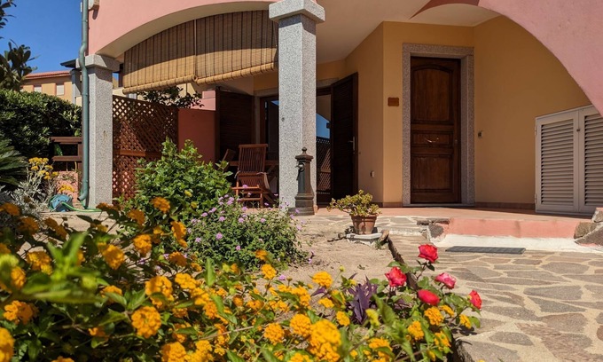 Lu Bagnu Apartment | Cozy Apartment Steps from the Sea with Oceanfront Pool