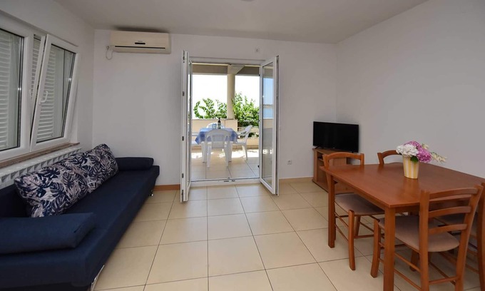 Novalja Apartment | Seaside Retreat: Family-Friendly Apartment with Scenic Views
