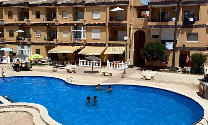 Punta Prima Apartment | Apartment 'Punta Prima Getaway' with Shared Pool, Wi-Fi and Air Conditioning