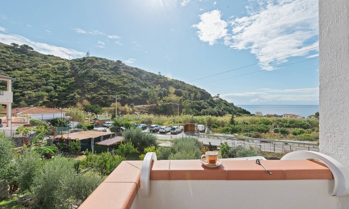 Pomonte Apartment | Seaside Retreat: Ramerino Apartment with Mountain Views