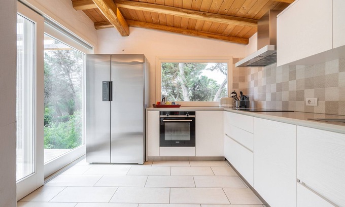 Notteri Apartment | Villa Flavia: Oceanfront Retreat with Private Garden