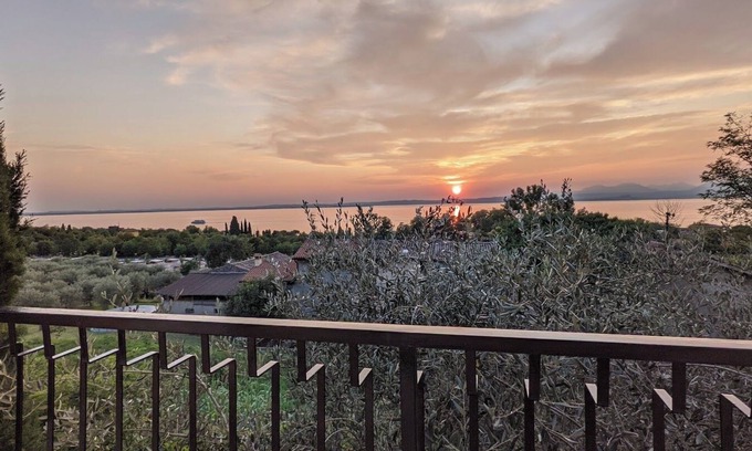 Cisano Apartment | Scenic Apartment with Lake View & Communal Pool, Rated 9.8