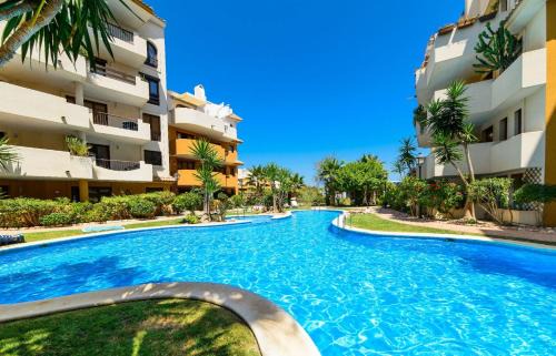 Punta Prima Apartment | Cozy Apartmento Carla with Ocean View & Pool Access