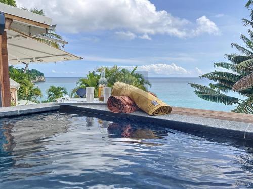 Perinet Apartment | Serenity Appt: Poolside Retreat with Ocean Views