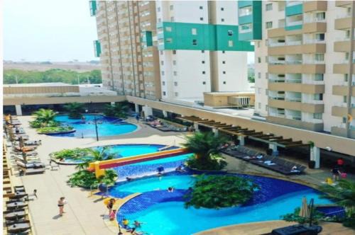Olimpia Apartment | Relax at Apto do Veloso Resort: 4-Star, Pool & Spa Access
