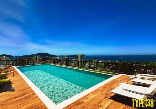 Enseada Apartment | Seaside Retreat with Rooftop Pool & Ocean Views