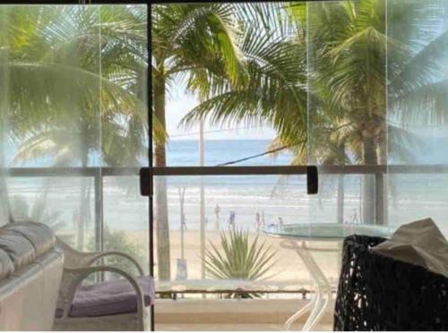 Vila Luis Antonio Apartment | Oceanfront Escape at Apto Pé Na Areia - Praia das Astúrias