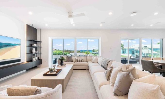 Seven Mile Beach Condo | Aqua #2: Full-Floor Luxury Condo on 7Mile Beach w/Oceanfront Terrace, Private Hot Tub, & Communal Pool.