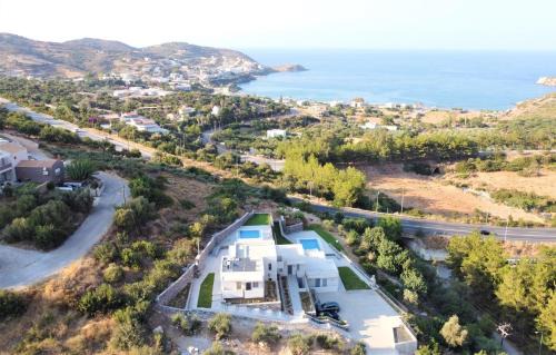 Vlichada Villa | Elegant Aquamarine Villas: Oceanfront with Hot Tub & Pool