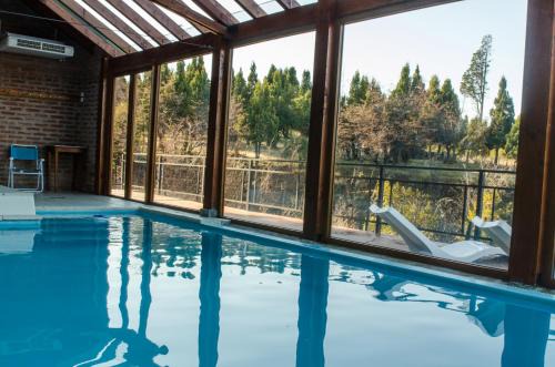 Trevelin Cabin | Experience Arroyo Escondido: Pool & Oceanfront Bliss