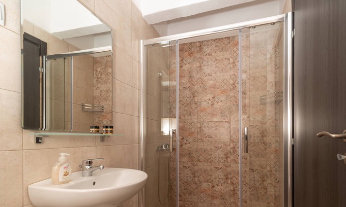 Karavostasi Apartment | Discover Artemis: Traditional Stone Built Studio Retreat