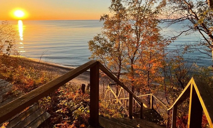 Laurium House | **Artistry view of Lake Superior with the allurement of Upper Entry Lighthouse *