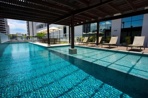 Caminho das Arvores Hotel | Discover Astron Suítes Mondial Salvador: Beachfront Bliss