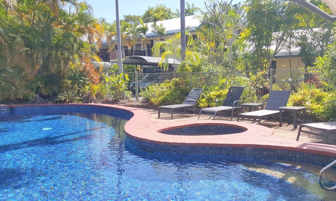 Port Douglas Apartment | Relax at The Mango Tree: Oceanfront Retreat with Spa