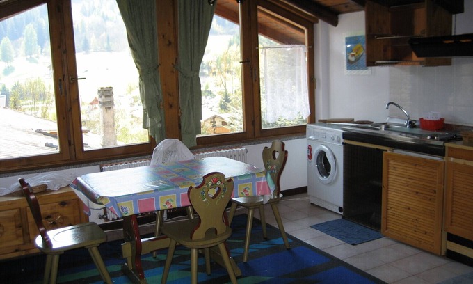 Mezzana Apartment | Elegant Attic Overview with Spa & Family-Friendly Amenities