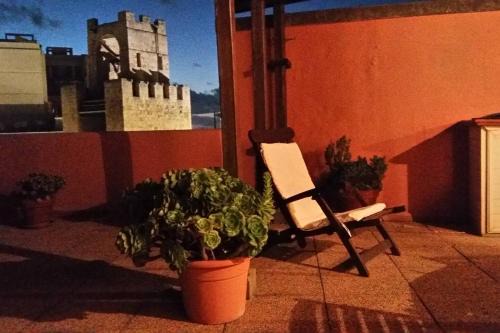Oristano Apartment | Charming Penthouse with Tower Views - Pet Friendly Retreat