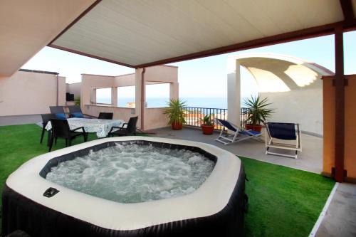 Santo Stefano di Camastra Apartment | Oceanview Retreat with Spa and Heated Terrace Awaits You