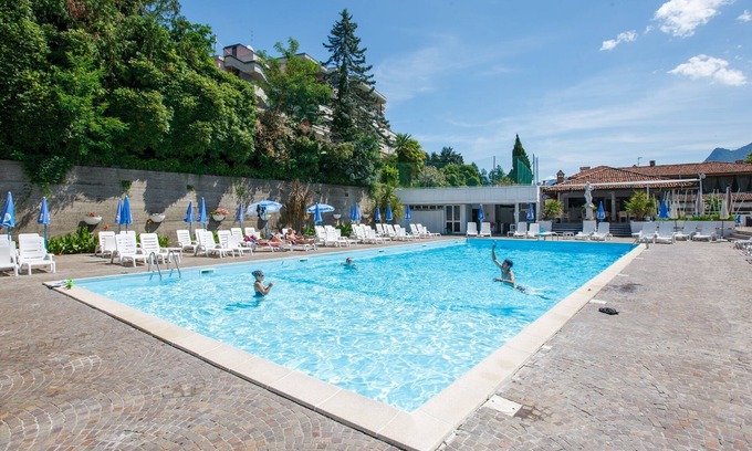 Susello Apartment | Inviting Studio with Terrace, Pool & Scenic Lake Views