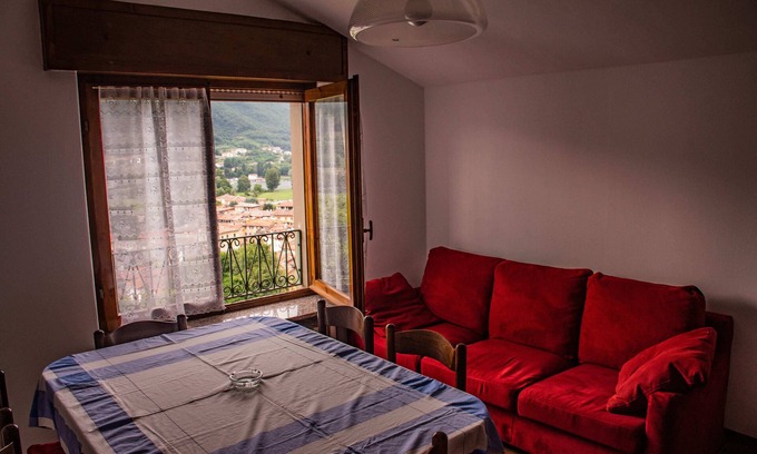 Monasterolo del Castello Apartment | Aunt Maria's Torrezzo Apartment: Scenic Terrace by Lake Endine