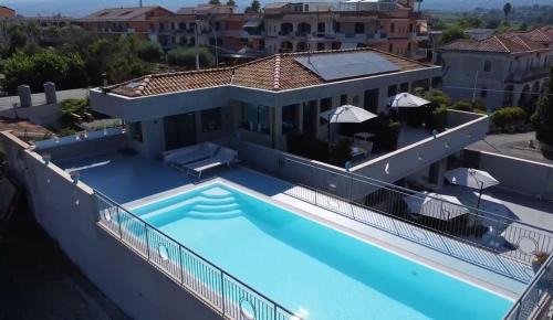 Fondachello Apartment | Experience Aurora View Resort: Oceanfront Bliss Awaits