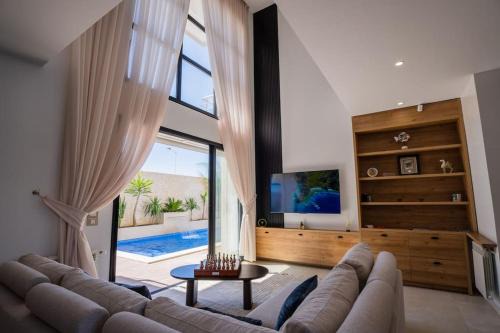 Cite El Wafa Villa | Relax at Aussie Beach Villa with Pool & Child-Friendly Fun