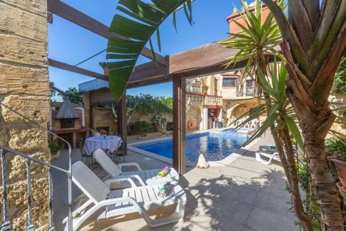 Xewkija Villa | Discover Ta Rummiena Farmhouse: Oceanfront Oasis with Pool
