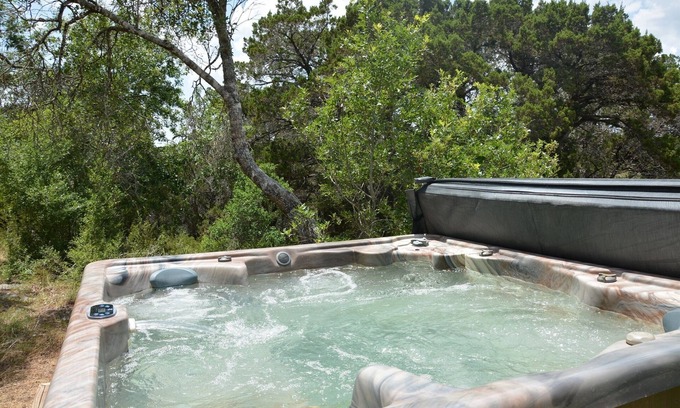 Hays County Cabin | Cozy Log Cabin Retreat with Private Hot Tub & Spa Amenities