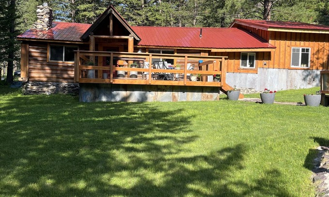 Alberton Cabin | Tranquil Family Cabin with Creek and Hot Tub Amenities