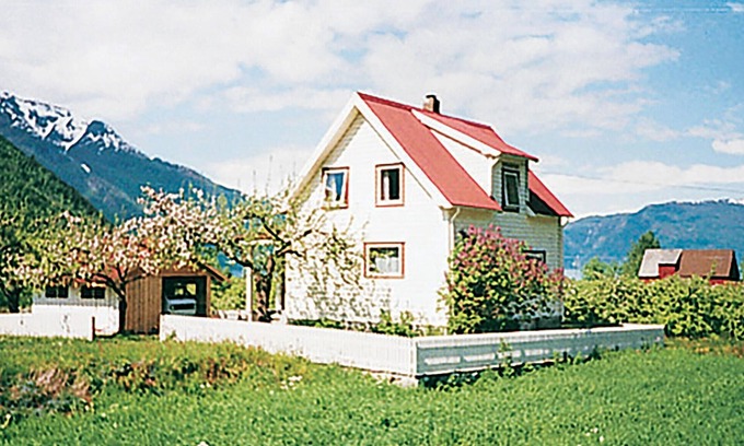 Fresvik House | Experience a Cozy Cottage Amidst Scenic Orchards