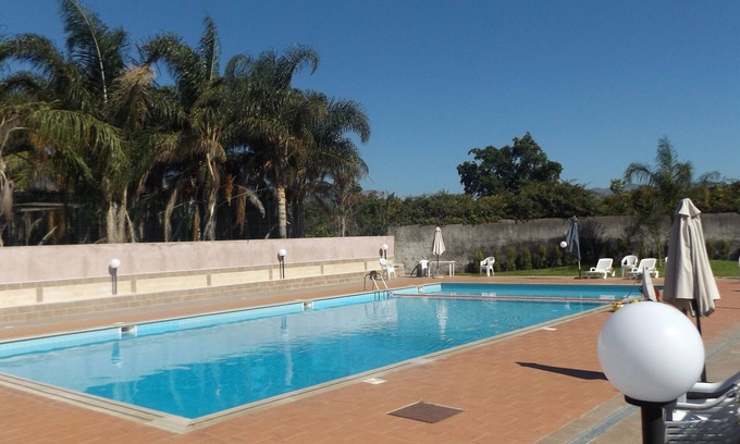 Mascali Apartment | Inviting Azzurro Mare: Oceanfront Pool & Breathtaking Views