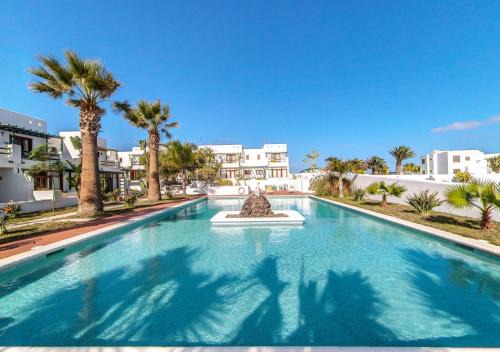 Charco del Palo House | Bright B13-Duplex with Pool, Steps from the Beach