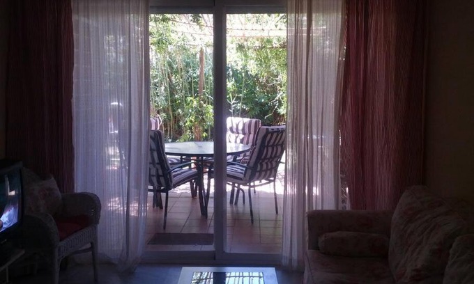 Islantilla Apartment | Charming Garden Retreat at Golf Islantilla for Families