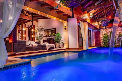 Noord House | Discover Bali Retreat Aruba: Pools, Cinema & Oceanfront Bliss