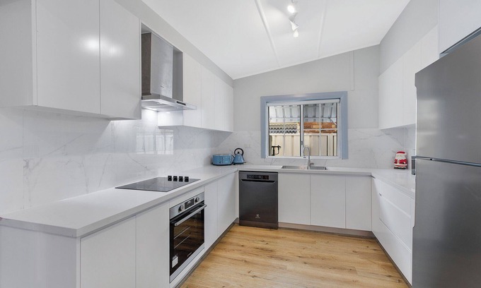 The Entrance Apartment | Beach Nest on Coral: Oceanfront Retreat with Pool & Views