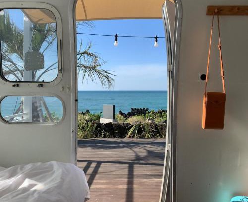 Aewol Apartment | Relax at BeachBoys - Retro Caravan Airstream with Ocean Views