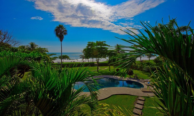 Carmen Villa | Beachfront Villa: 5 Bedrooms, Pool & Ocean Views Await