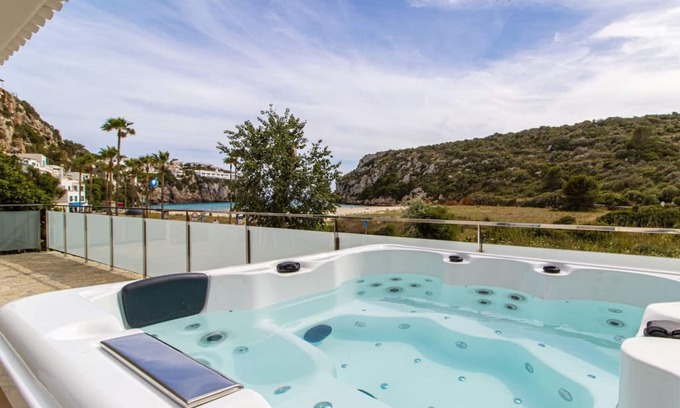 Cala en Porter Apartment | Beachfront Retreat with Jacuzzi & Ocean Views at Casa 4Brothers