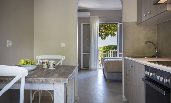 Lourdata Apartment | Beachfront Studio No 2: Steps from the Shore with Breakfast