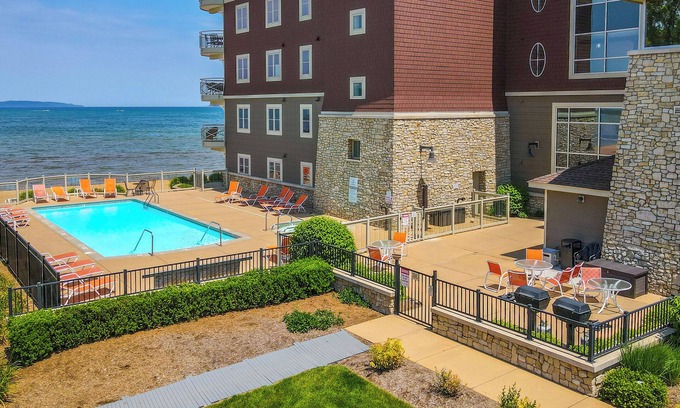 Traverse City Condo | Top-Rated Beachfront Traverse City Resort Condo with Pool