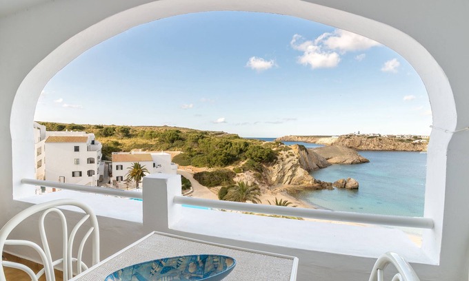 Arenal d'en Castell Apartment | Oceanfront Apartment with Pool, Terrace & Top Ratings