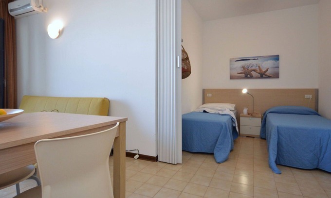 Lignano Sabbiadoro Apartment | Cozy Apartment for 4 with Pool, Pets Welcome & Ocean View