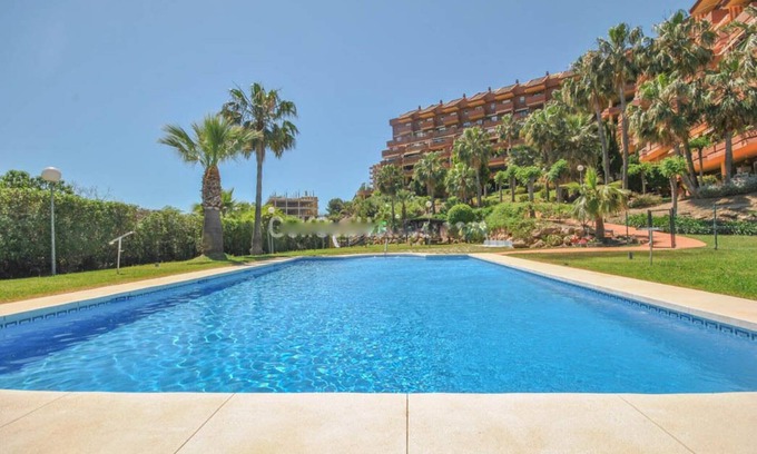 Torrequebrada House | Inviting Apartment Steps from the Sea with Pool Access