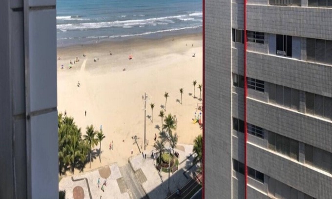 Praia Grande Apartment | Beautiful apartment in front of the sea, walk in the sand ....