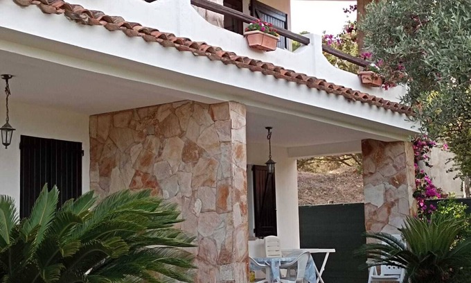 Porto Pino Apartment | Seaside Retreat: Villa Apartment with Breathtaking Views