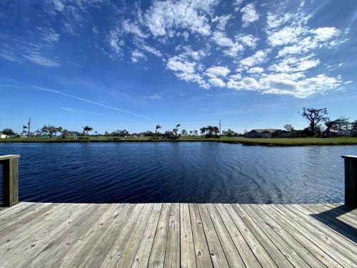 Pebble Beach House | Scenic Canal & Gulf Waterfront Home with Family-Friendly Perks