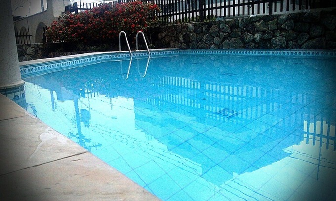 Jardim Vitoria Apartment | Guest Rated 9.8: Beachside Enseada Apartment with Pool