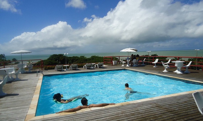 Tambau Apartment | Ocean View Flat in Tambau with Pool and Terrace Retreat