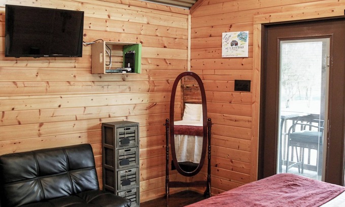 Pipe Creek Cabin | Scenic Log Cabin with Pool and Breakfast Overlooking Meadow