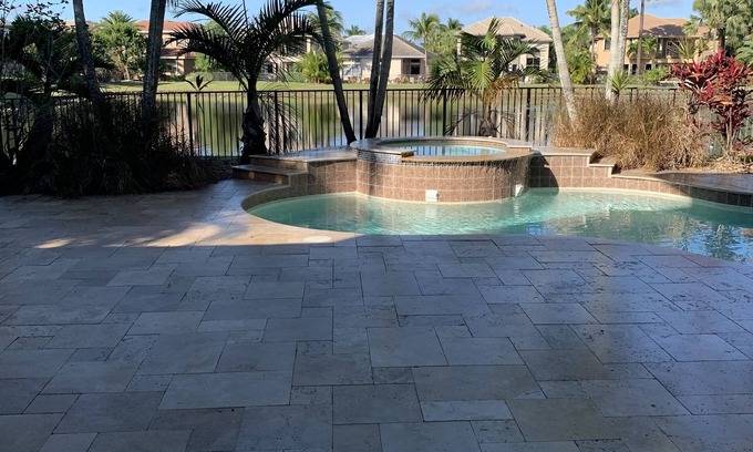 Lake Worth House | Elegant Cabana Bay Bedroom with Private Patio Access